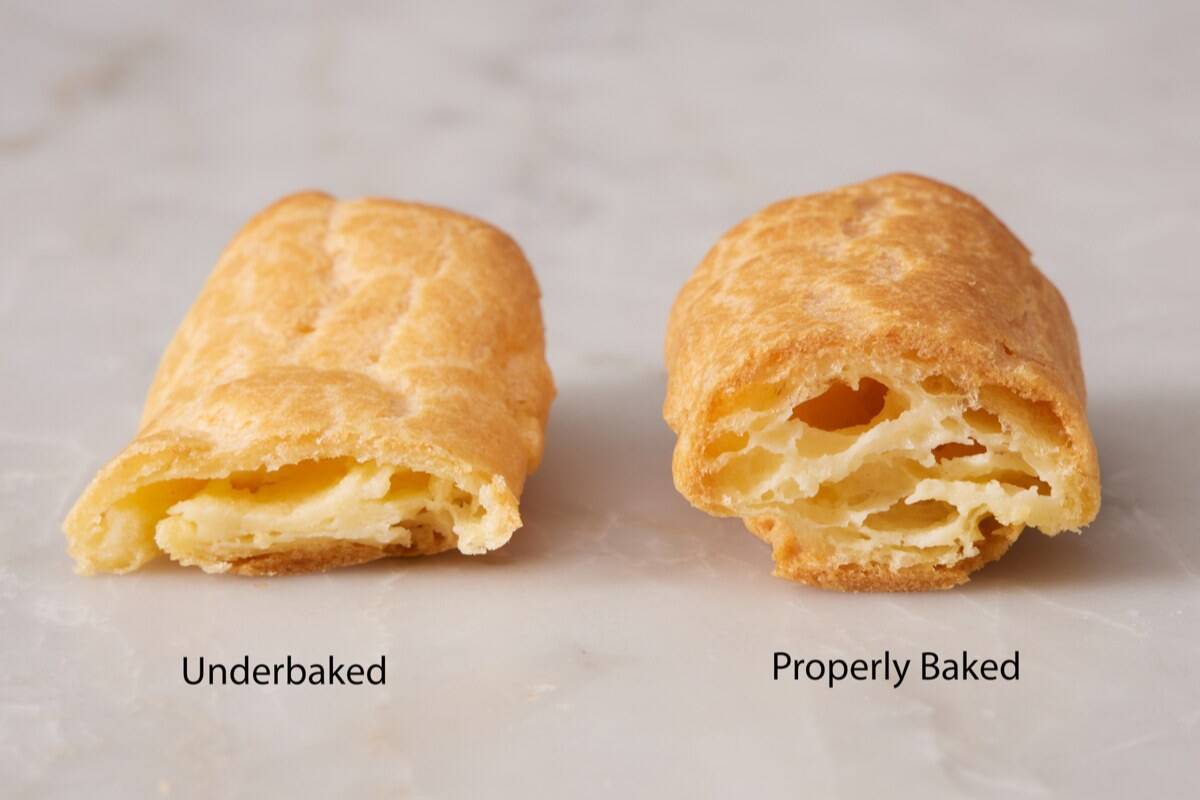 Comparison photo showing an underbaked vs. properly baked eclair.