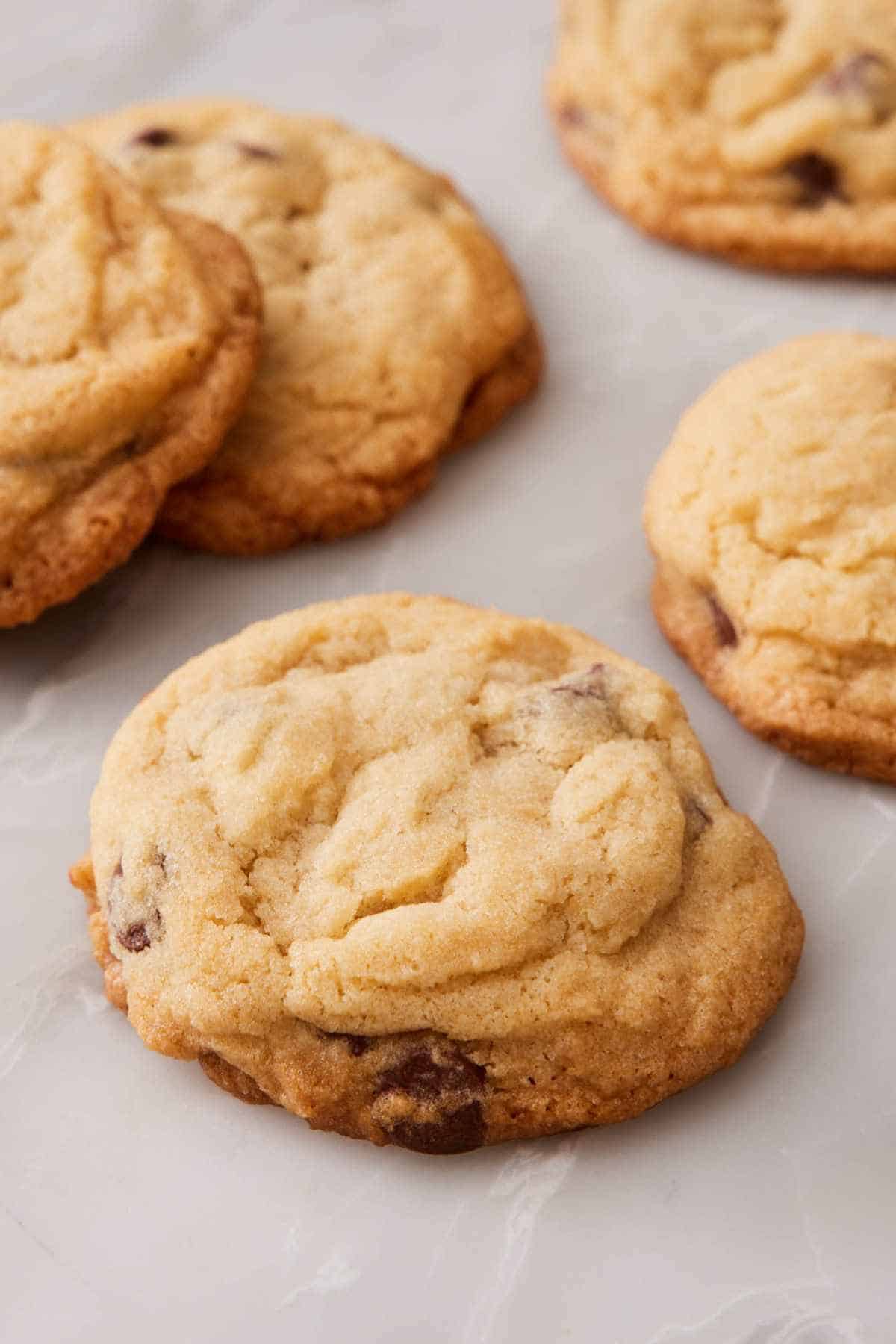 Close-up of a baked cookie, with more around it out of focus.