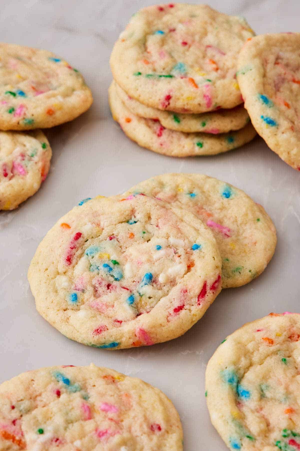 Several funfetti cookies on a countertop.