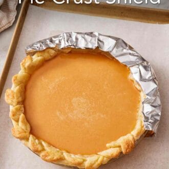 Pinterest graphic showing a pumpkin pie on a baking tray with half the edge shielded with foil.