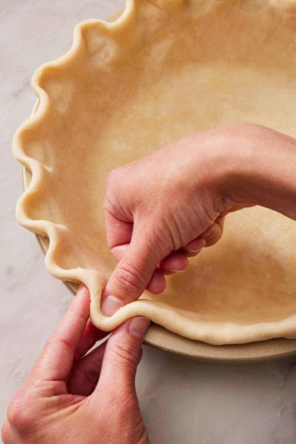 How to crimp pie crust using the traditional method.