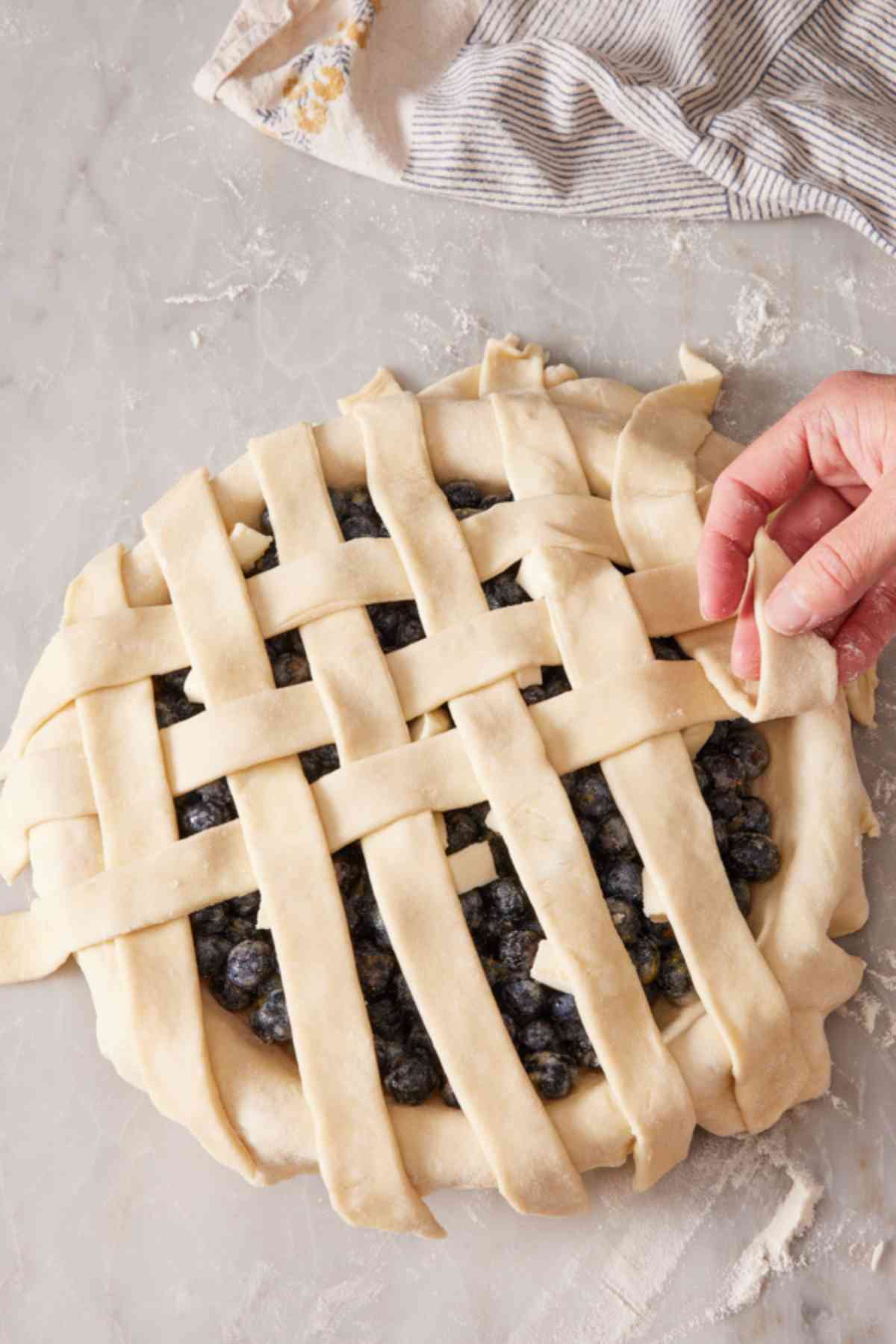 A pie in the process of getting a lattice top.