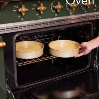 Pinterest graphic showing two cake pans placed in an oven.