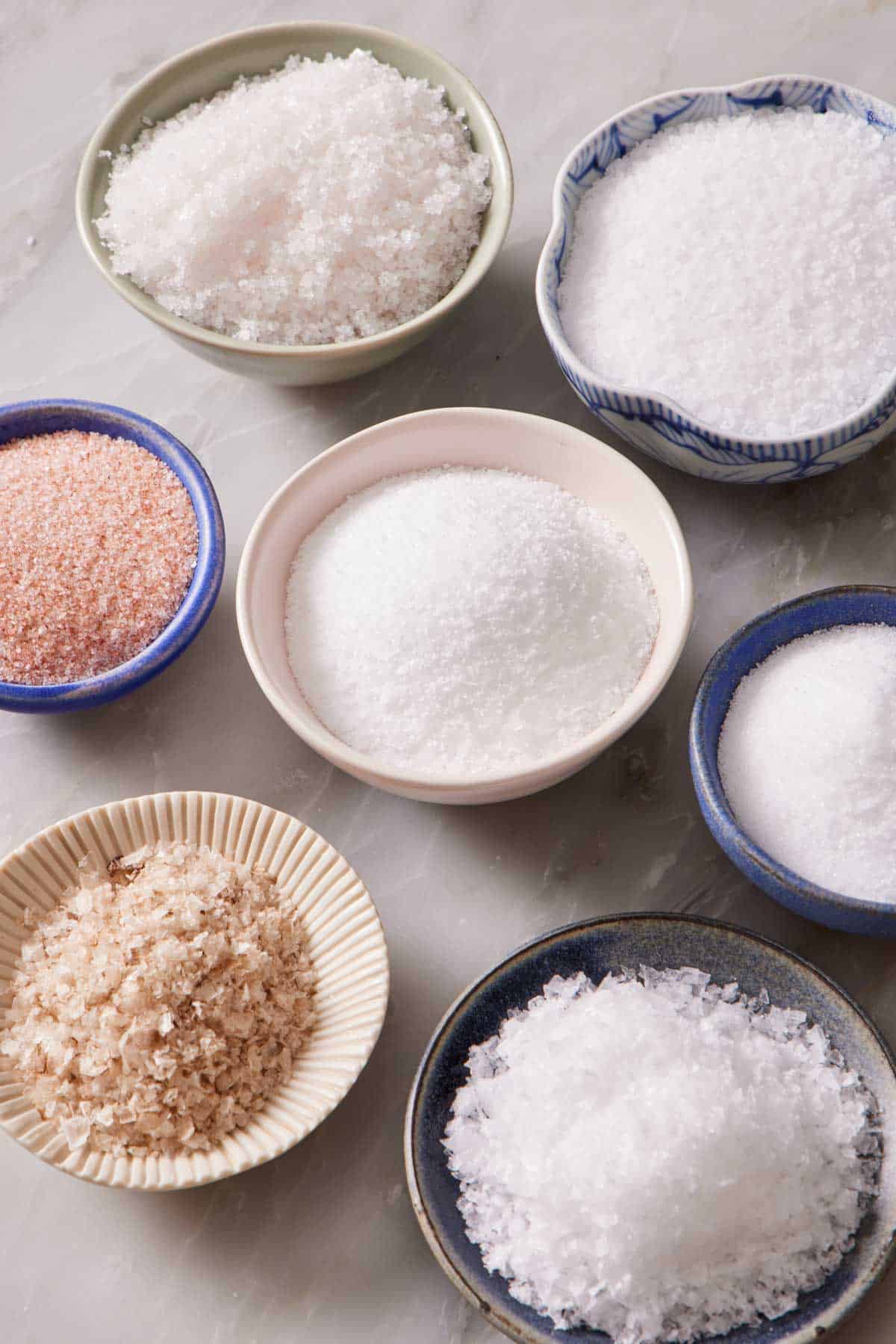 Bowls containing different types of salt.