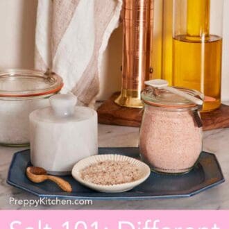 Pinterest graphic showing fine and coarse pink salt in vessels on a platter with oil and sea salt in the background.