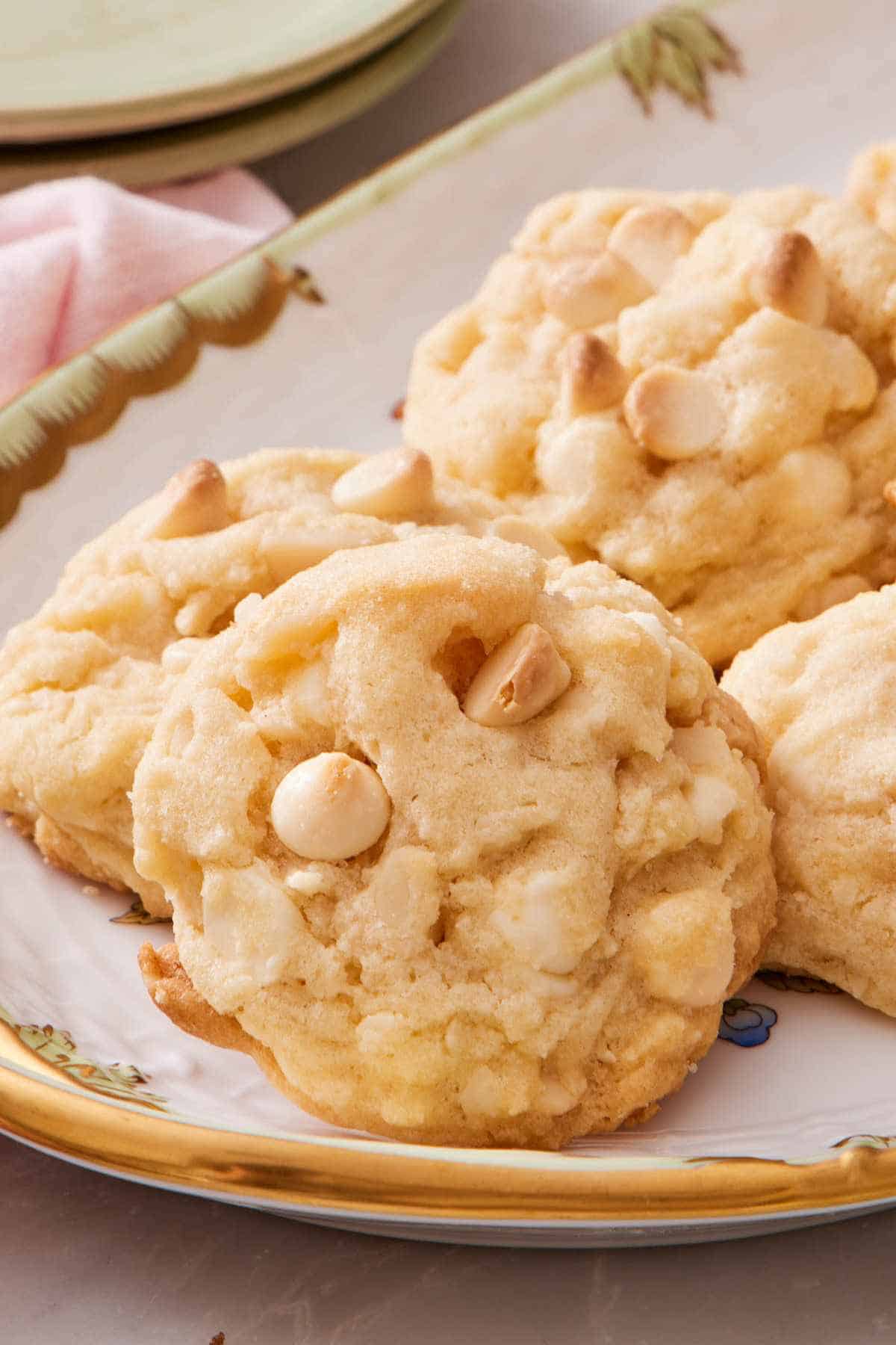 Close-up of white chocolate chip cookies on a platter.