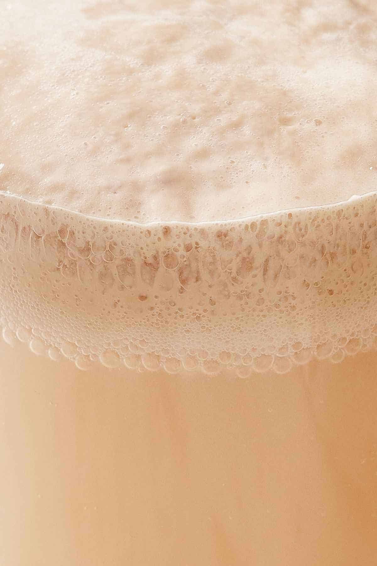 Close-up of bloomed yeast showing the foamy top.