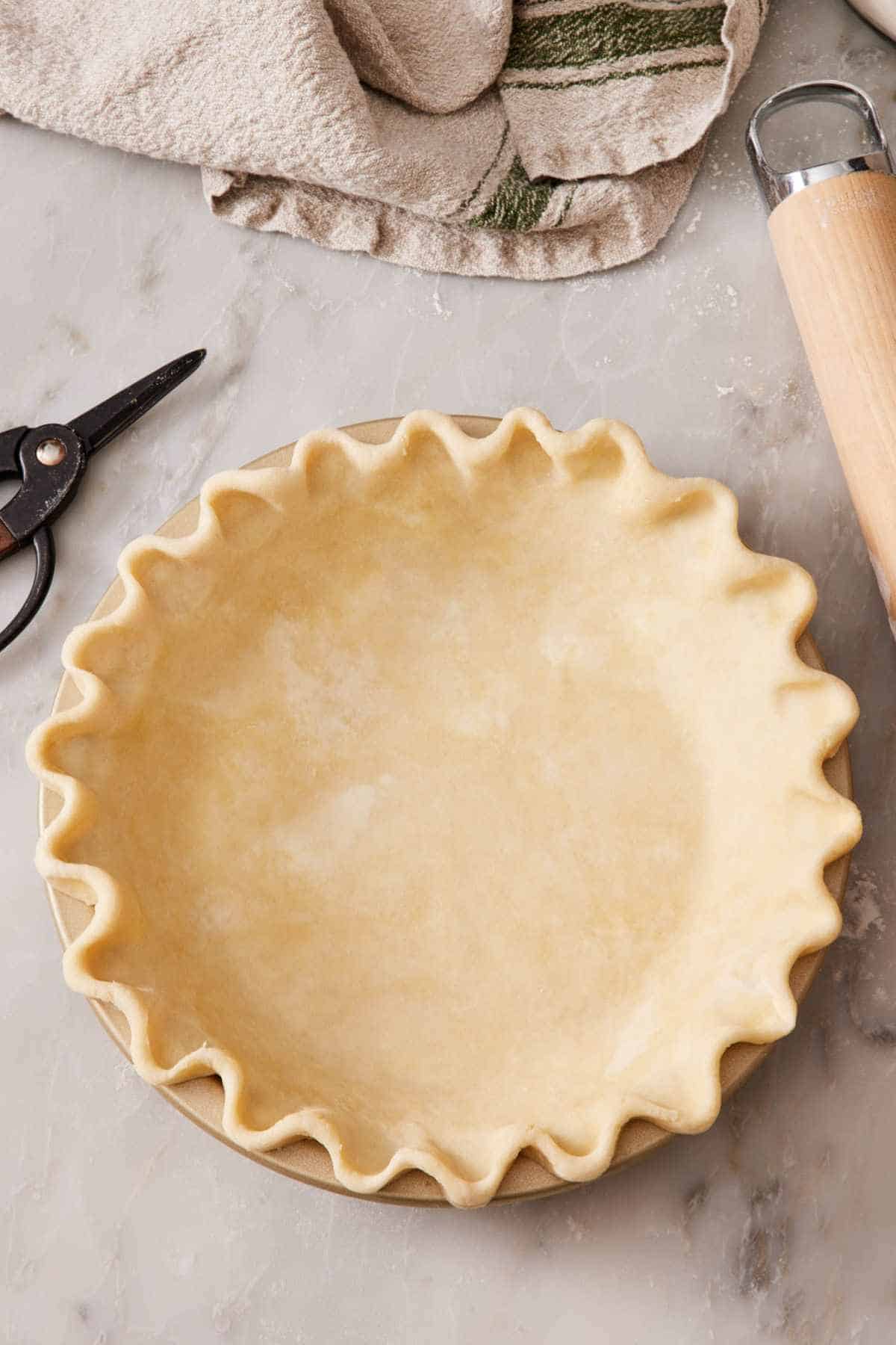 Overhead view of a pie crust with a traditional crimp.