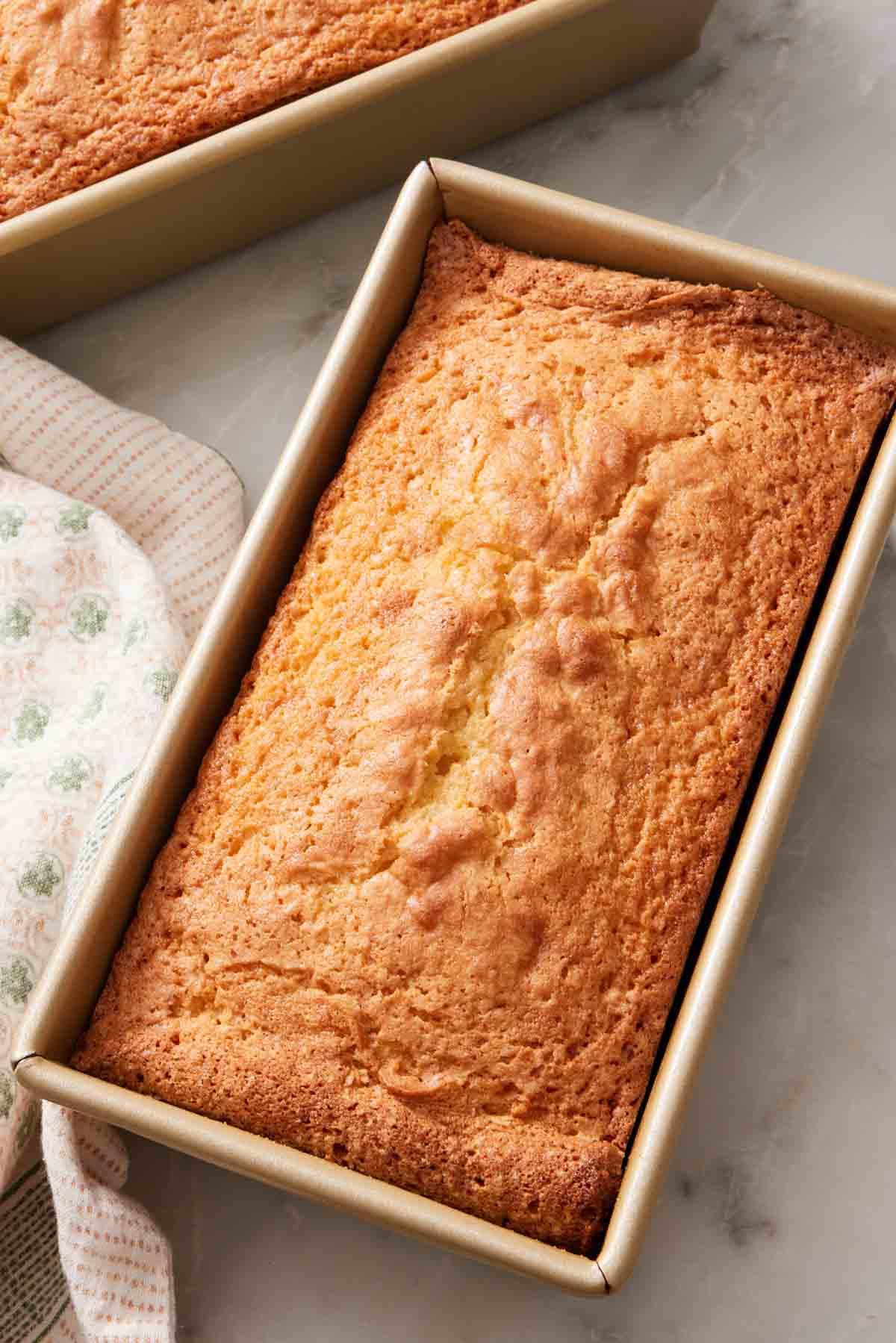 A baked loaf in a loaf pan.