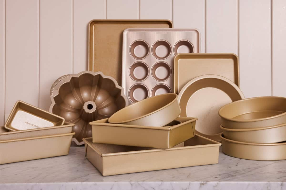 Close-up of various baking pans on a kitchen counter.