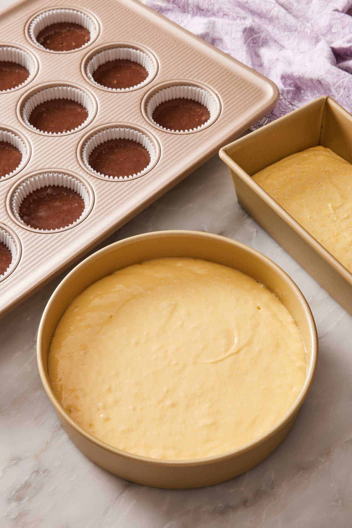 Image depicting how much batter to pour into cake and muffin pans.