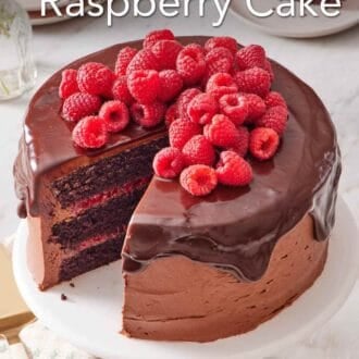 Pinterest graphic showing chocolate raspberry cake on a cake stand with a slice cut out.