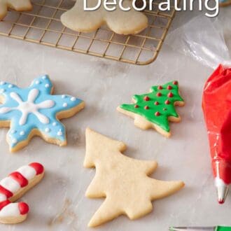 Pinterest graphic showing some decorated and some plain cookies on a countertop and on a wire rack.