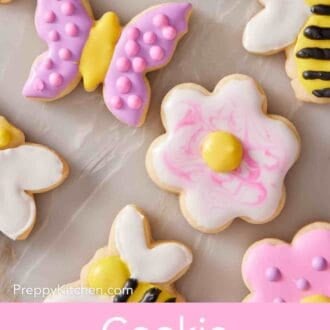 Pinterest graphic showing an overhead shot of decorated cookies of various shapes.