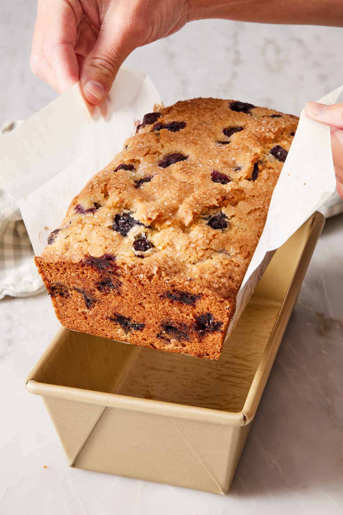 A quick bread lifted out of the pan using the sling.
