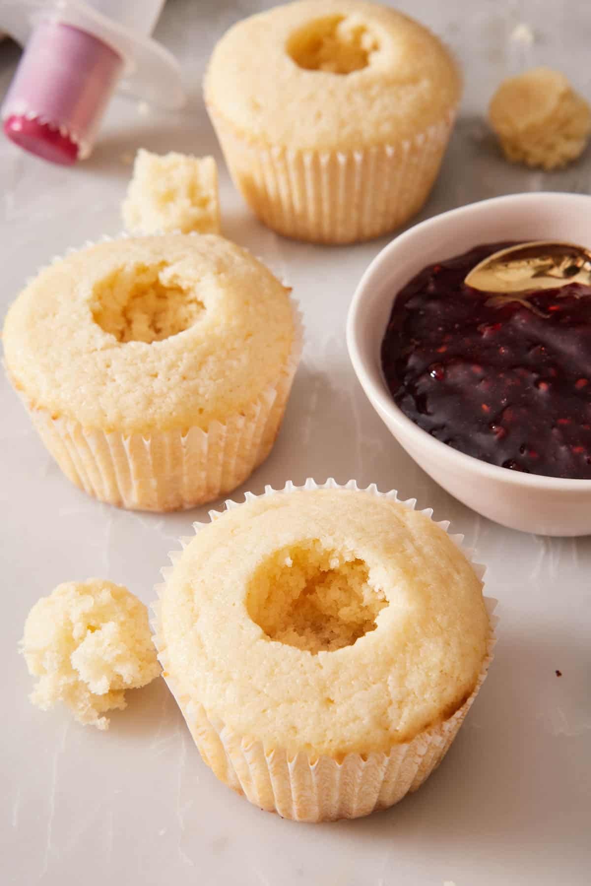 Vanilla cupcakes with the centers removed ready for jam filling.