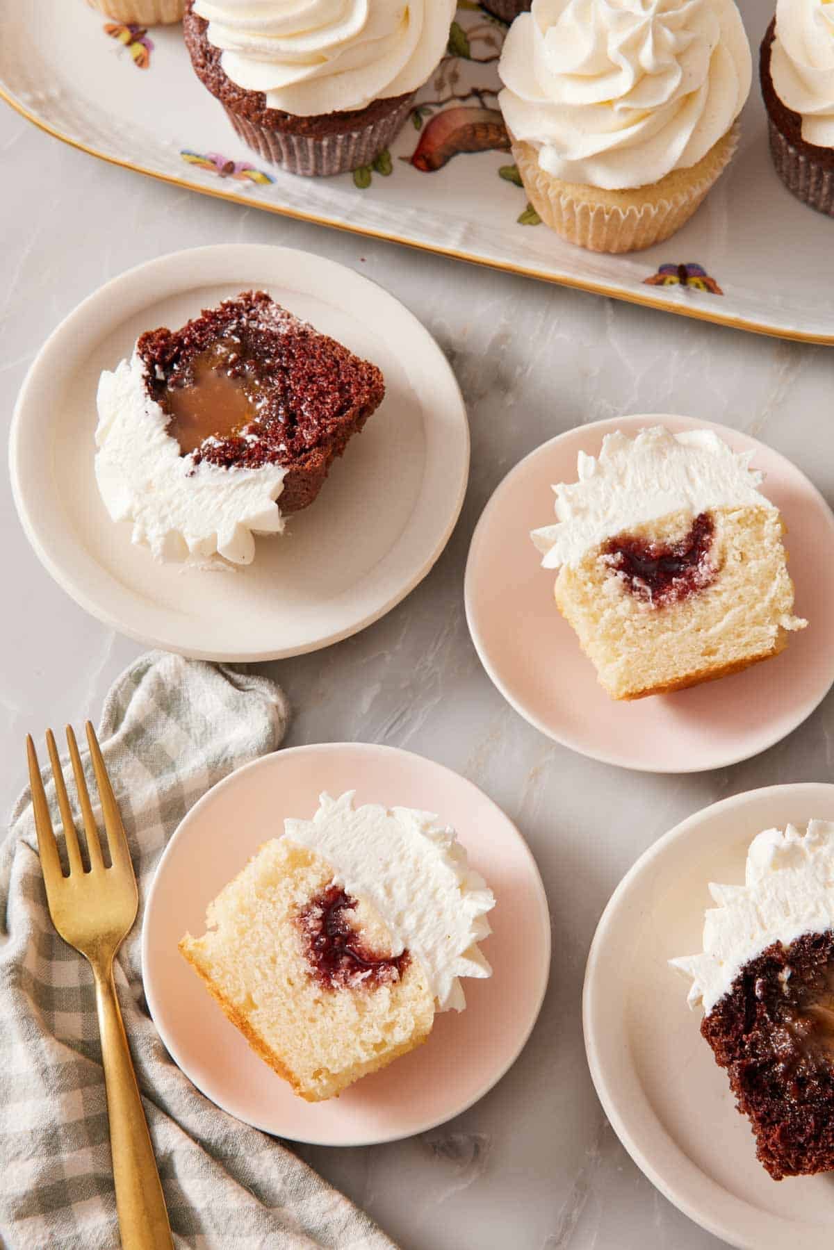 Overhead shot of halved cupcakes showing the filling.