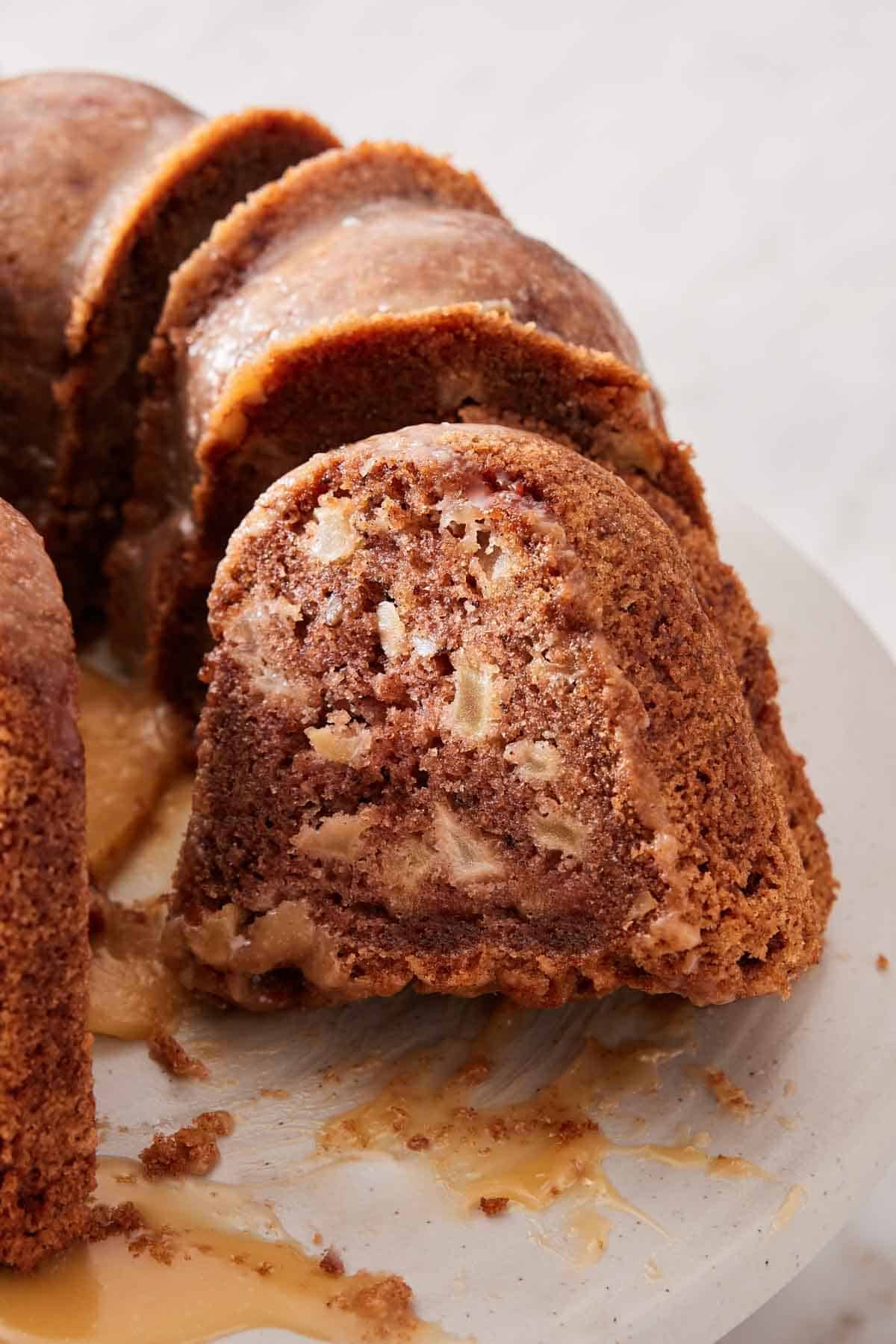Close-up of apple bundt cake on a cake stand.