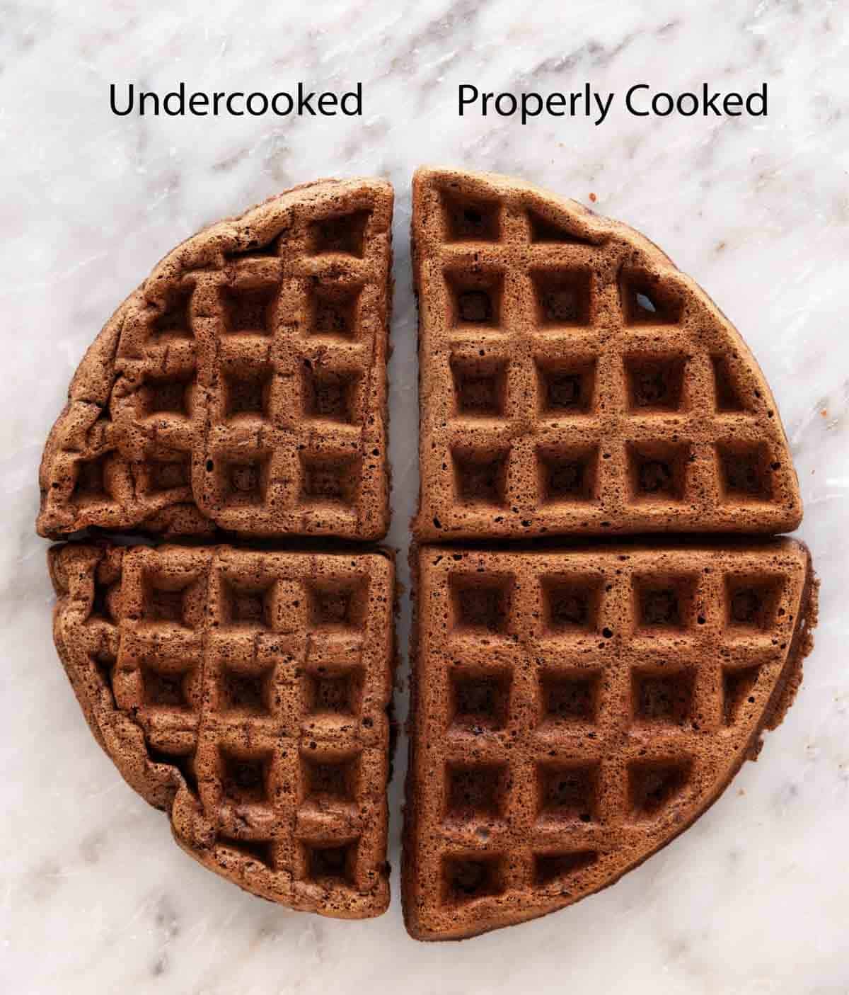 Overhead shot of two waffle halves placed together. One half is properly cooked and the other is undercooked.