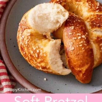 Pinterest graphic showing a torn homemade soft pretzel on a plate.