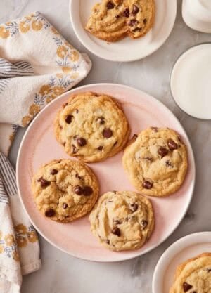 Overhead shot of chocolate chip cookies on plates.