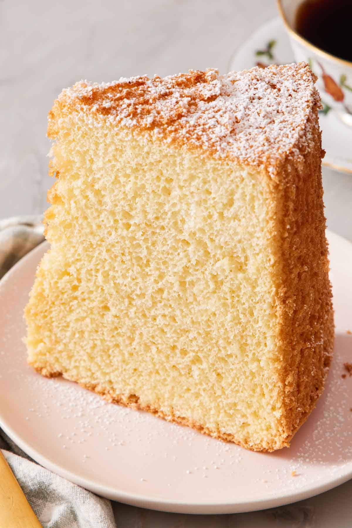 A slice of chiffon cake on a small plate.