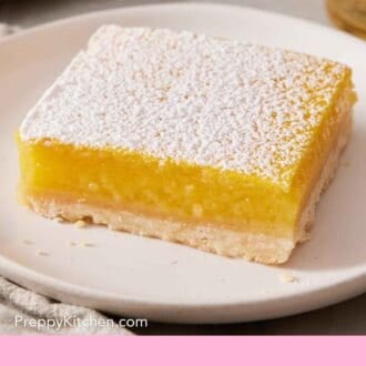 Pinterest graphic showing a close-up of a lemon bar on a small plate.
