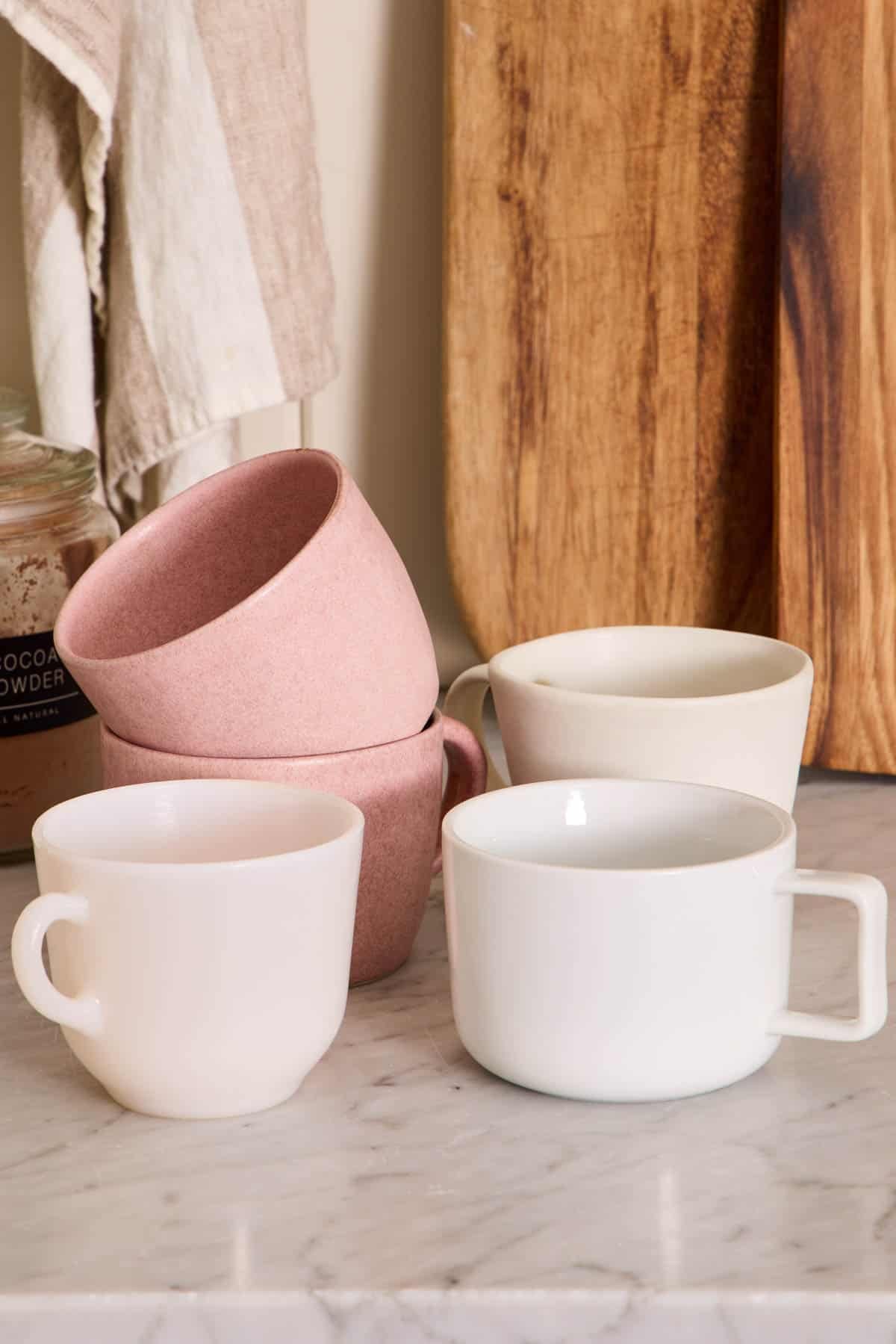 The best mugs for making brownie in a mug, set on a marble counter.