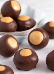 close up of buckeyes on a white surface